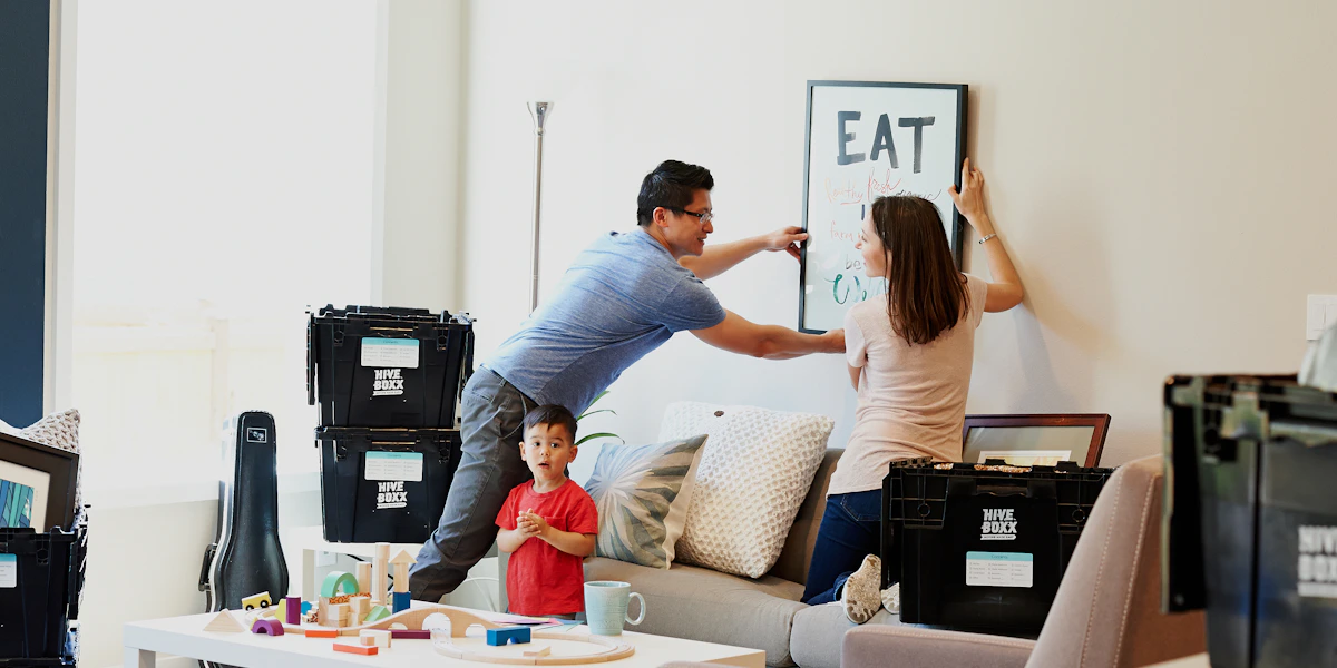 A family settling into a home with moving boxes